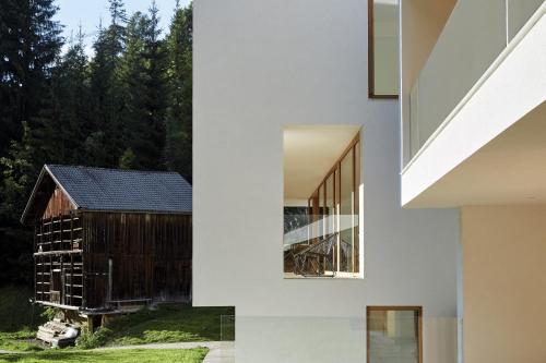 a house with a view of a barn at Greva Apartments 1 in Santa Cristina in Val Gardena