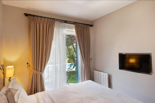 Postel nebo postele na pokoji v ubytování Bramasole Alaçatı Butik Hotel