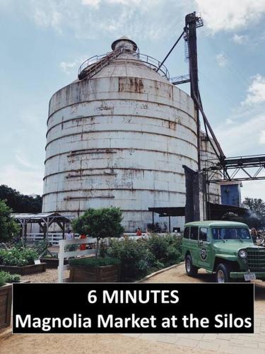 a green van parked in front of a silo at New White On Columbus Family Gathering Place in Waco