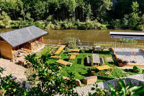 a miniature garden with a building and a river at Apartmány Svatošské skály in Loket