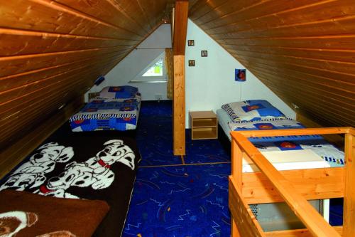 a room with two beds in a attic at Ferienhaus Barbara in Masserberg