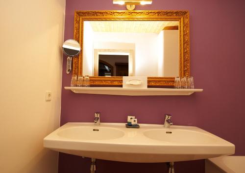 a bathroom with a sink and a mirror at GMS Holidays in Katschberghöhe