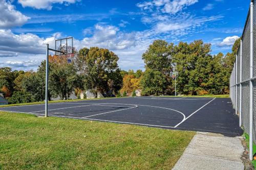 a basketball court in a park with trees at Orr at Waterways in Huddleston