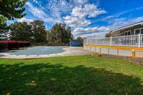 a backyard with a white fence and a basketball court at Orr at Waterways in Huddleston
