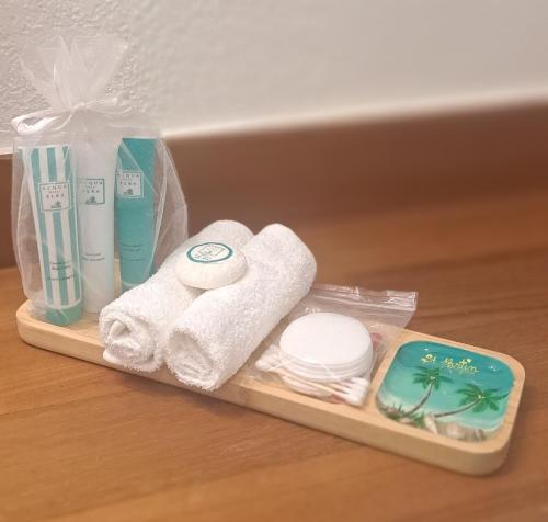 a tray with towels and other items on a table at Studio TI BO 4 in Saint Martin