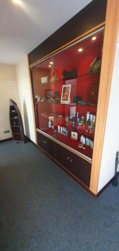 a room with a large glass display case with medicines at Hotel Daytona Palace in Casoria