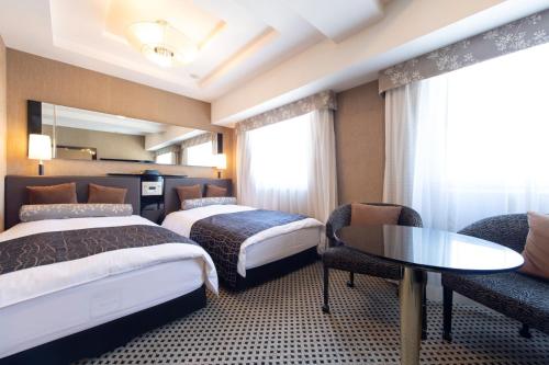 Tempat tidur dalam kamar di APA Hotel TKP Nippori Ekimae