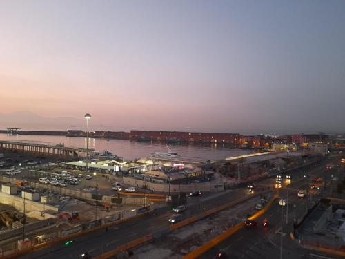 a city with a parking lot and a harbor at President Plaza Vip Suite Spa by Babylon Stay in Naples