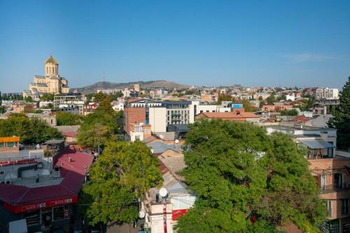 an overhead view of a city with trees and buildings at Hotel Best Tbilisi in Tbilisi City