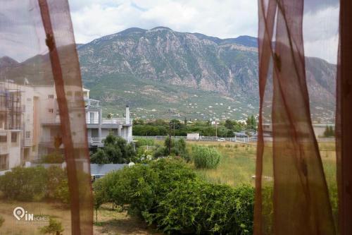 a view of a mountain from a window at 'On The Wave' With Amazing View in Faraí