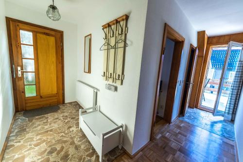 a hallway with a staircase in a house at Im alten Kino in Fehrenbach