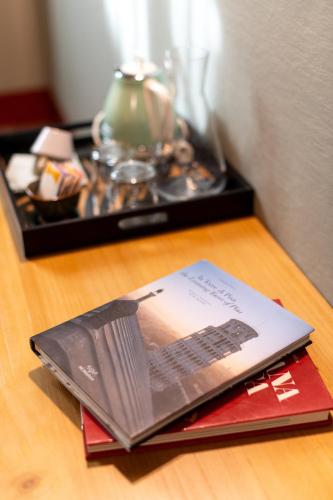 a book sitting on top of a wooden table at Casa Leopoldo in Pisa