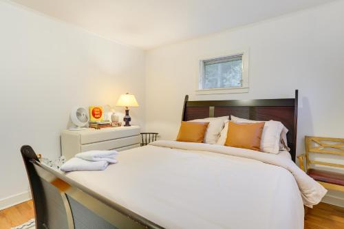 a bedroom with a large bed with orange pillows at Narrowsburg Home with Backyard Near Delaware River! in Narrowsburg