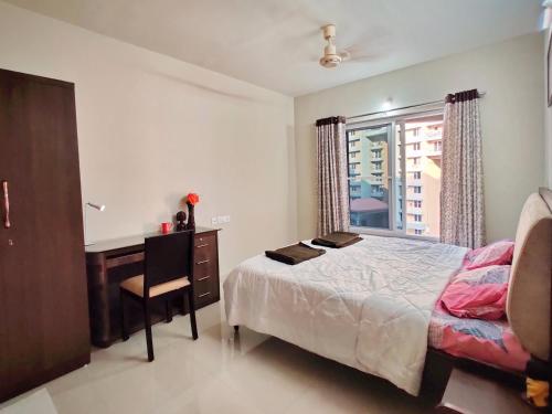 Cama o camas de una habitación en Symphony Apartments at MIHAN Nagpur