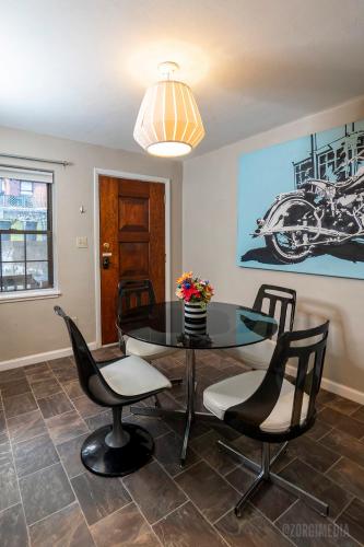 a dining room with a table and chairs at The Andrew and Andy on Mt Washington in Pittsburgh