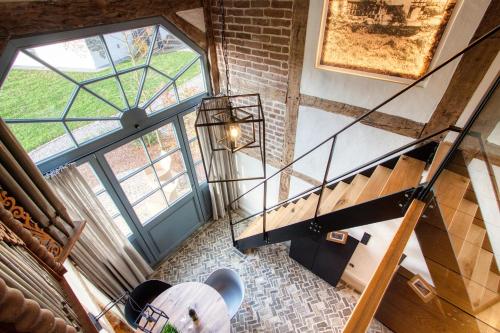 an overhead view of a staircase with a large window at Michels Mühle - up de lütt Deel in Brilon