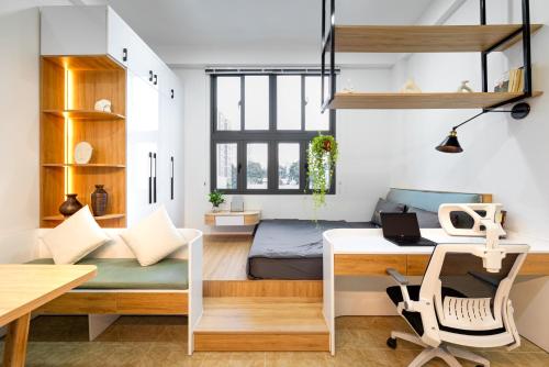 En eller flere senge i et værelse på Sweet Rentals Homes Ho Chi Minh