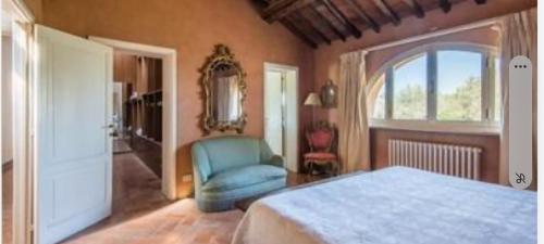 Villa Nannini Siena tesisinde bir odada yatak veya yataklar