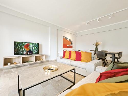 a living room with a couch and a table at Dimitsanas by Verde Apartments in Athens