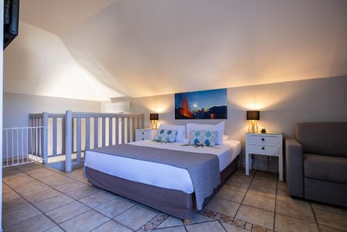 Postel nebo postele na pokoji v ubytování Hôtel Les Créoles