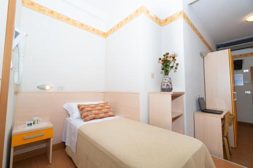 Postel nebo postele na pokoji v ubytování Hotel Sampaoli