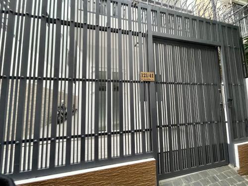 a large metal garage door with a sign on it at Amazing Merit Ben Thanh in Ho Chi Minh City