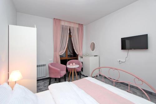 En eller flere senge i et værelse på Elis Hotel Tsaghkadzor