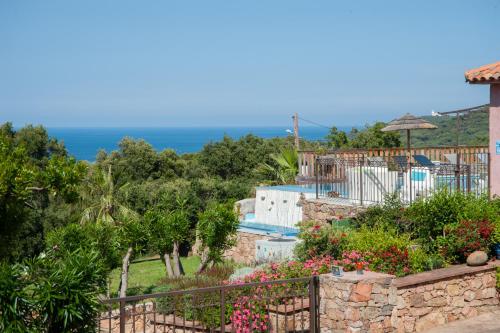 a villa with a view of the ocean at Résidence U Pirellu in Porto-Vecchio