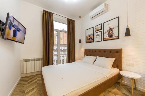 Ein Bett oder Betten in einem Zimmer der Unterkunft DayFlat Apartments Khreschatyk