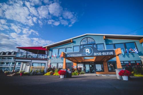 a large building with a sign for a sake brewery at Riôtel Carleton-sur-Mer in Carleton sur Mer