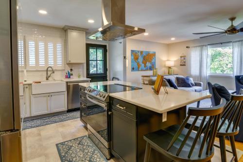 a kitchen with an island with a stove top oven at Luxurious Morgantown Retreat with Stunning Views! in Morgantown