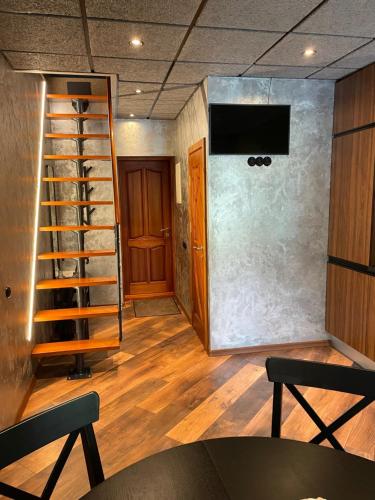 a room with a staircase and a wall with a shelf at BRIVIBAS RESIDENCE - WAVE, free PRIVAT parking, free WIFI, self check-in in Riga