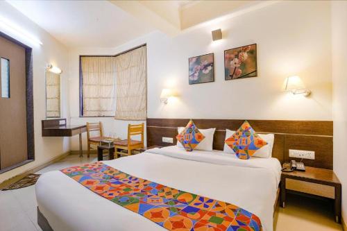 Cama o camas de una habitación en Gandharva Residency Swargate