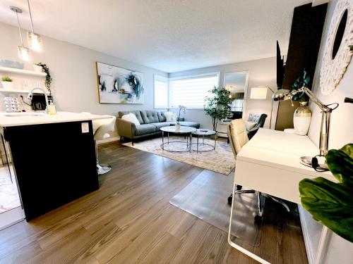 a living room with a couch and a table at *NEW: Stylish Wortley 1BR Suite in London