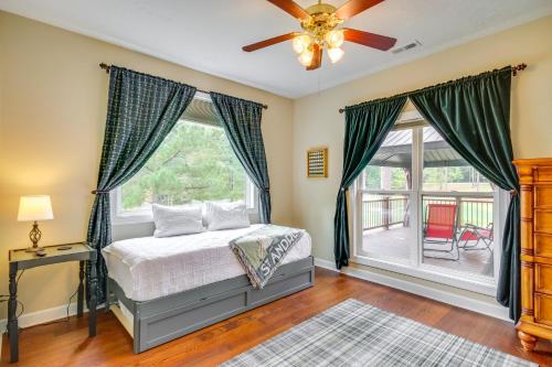 a bedroom with a bed and a ceiling fan at McCormick Home Monticello Golf Club Getaway! in McCormick