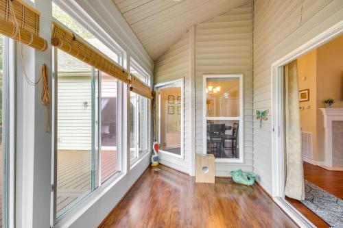 an empty room with large windows and wooden floors at McCormick Home Monticello Golf Club Getaway! in McCormick