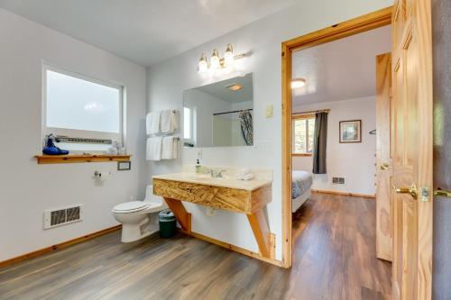 a bathroom with a sink and a toilet at Sanderling Sea Cottages, Unit 13 in Waldport