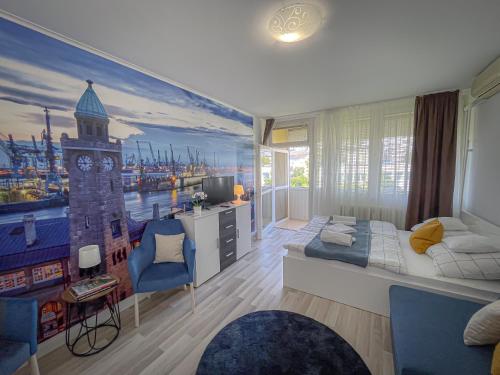 a bedroom with a large mural of a clock tower at Villa Blue Arany Apartman in Szekszárd