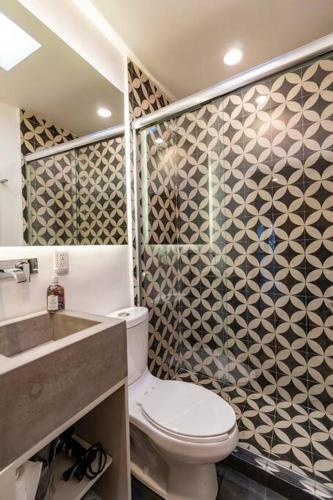 a bathroom with a toilet and a sink at LOVELY LOFT IN COYOACÁN (FRIDA) by M&I in Mexico City