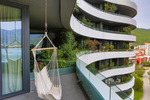 a hammock hanging from the side of a building at Royal Gardens Paradise in Budva