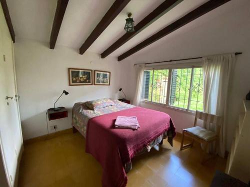 En eller flere senger på et rom på Casa Margaret - Hermosa vista a la Sierra