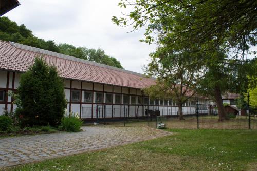 a large building with a lot of windows at Gut Dankerode in Dankerode