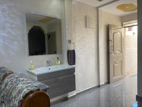 a bathroom with a sink and a mirror at Chic 3 Bed Villa in heart of Agadir in Agadir