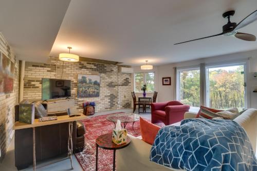 a living room with a brick wall at Renovated Studio on 5 Acres - Near Vineyards! in Crozet