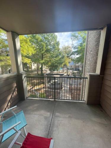 a balcony with a blue bench and a fence at Make it your own!(Willow Bend) in Plano