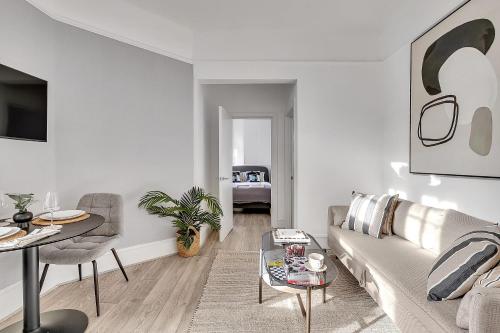 a living room with a couch and a table at The Abingdon in London