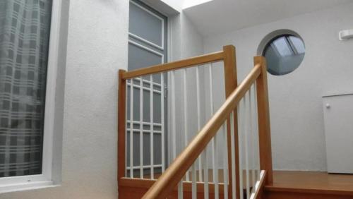 a stairway with a window and a stair railing at Appartements Au Cros De Cagnes in Cros-de-Cagnes