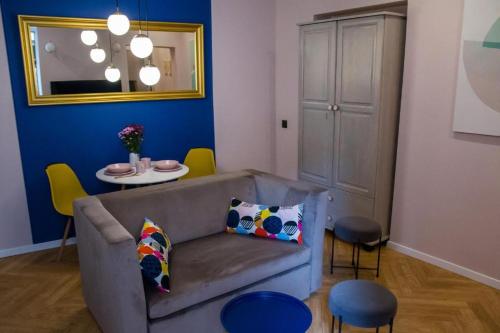 a living room with a couch and a table at HOLI in Toruń