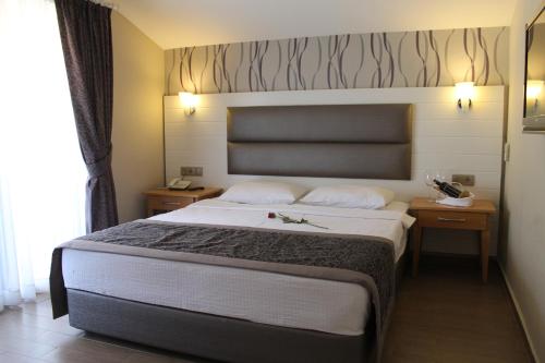 Кровать или кровати в номере Ida Hotel