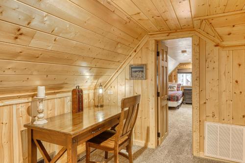 a dining room with a wooden table in a log cabin at Black Bear Hideaway in South Lake Tahoe
